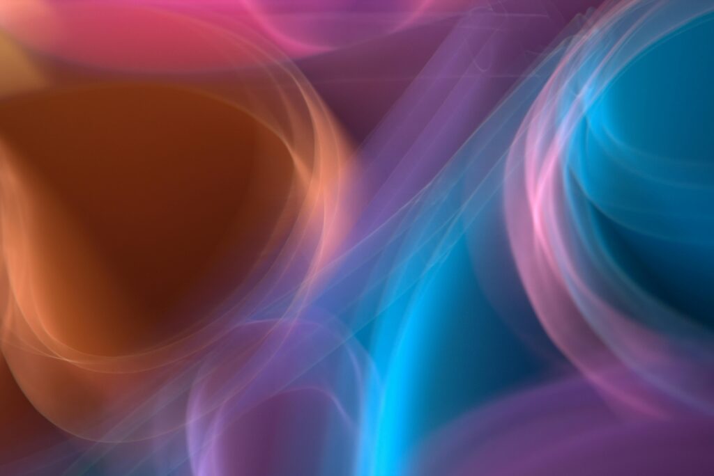 A vivid abstract display of swirling colorful lights with soft shapes and gradients.